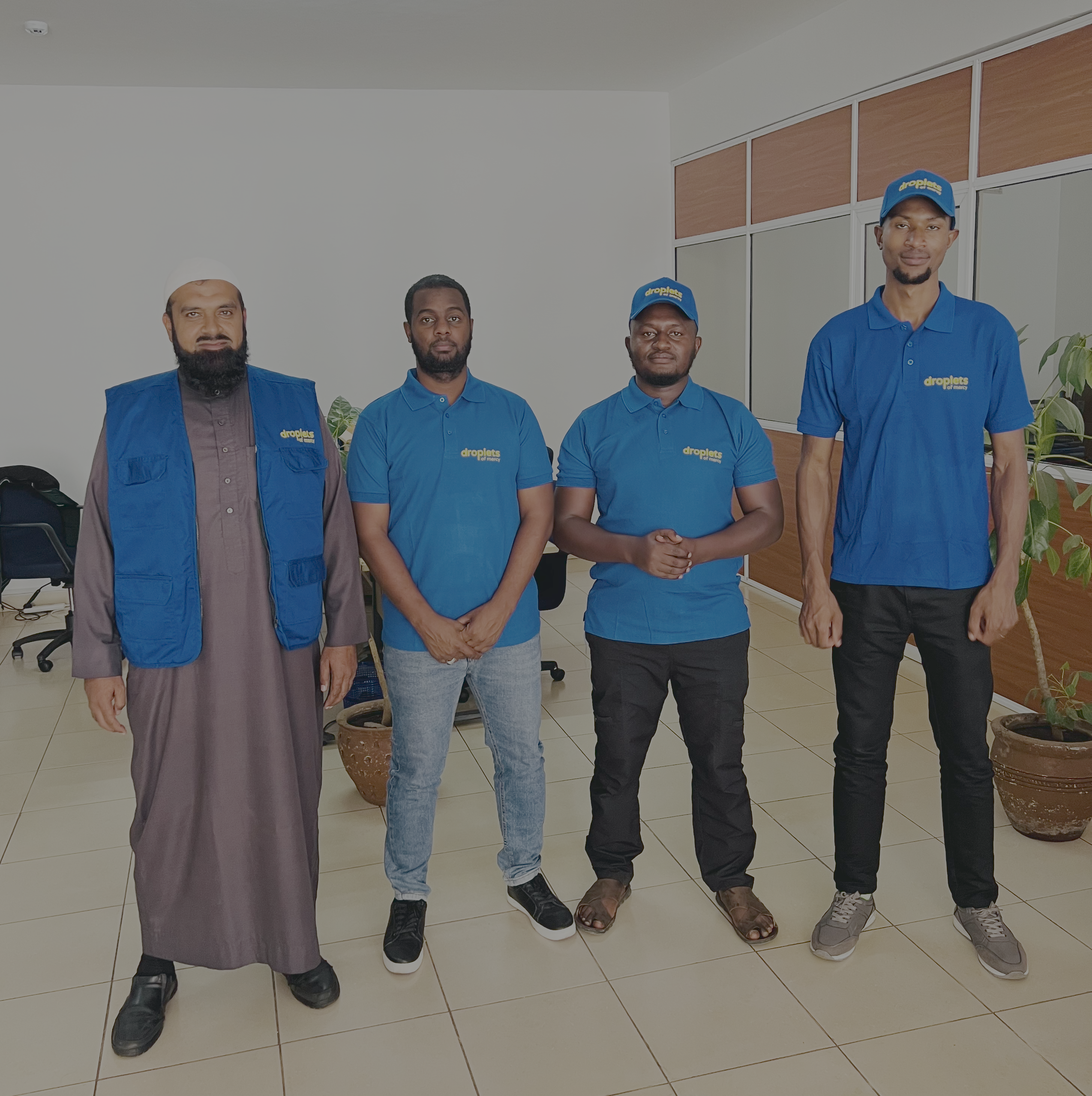 Four members of the Droplets of Mercy team at the Kenya regional office
