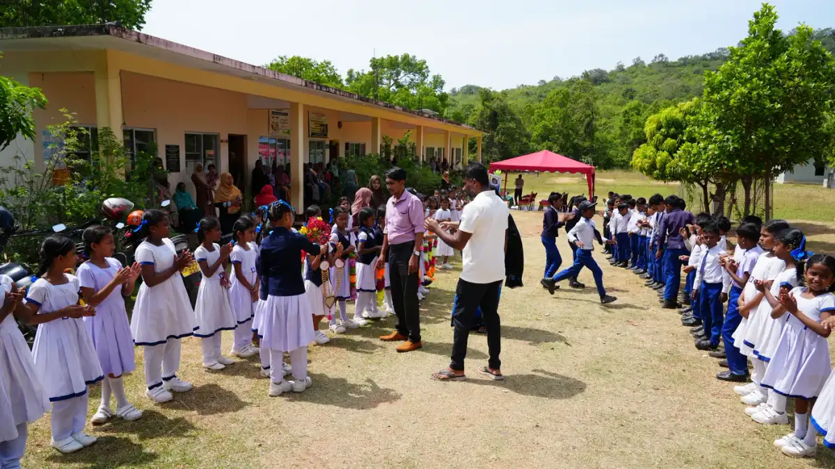 Schoolchildren in uniform welcoming the Droplets of Mercy team in Trincomalee, Sri Lanka